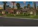 Beautiful home featuring lush landscaping, mature trees, and a well-maintained lawn at 1813 Skyline Dr, Las Vegas, NV 89117