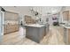 Modern kitchen with a spacious island, pendant lighting, and stainless steel appliances at 1813 Skyline Dr, Las Vegas, NV 89117