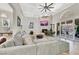 Comfortable living room featuring a cozy fireplace, modern ceiling fan, and sliding glass doors at 1813 Skyline Dr, Las Vegas, NV 89117