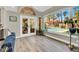 Bright sitting area with a view of the pool featuring a waterfall visible through large windows at 1813 Skyline Dr, Las Vegas, NV 89117