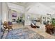 An elegant open-concept living room with a fireplace and seamless flow to the dining and kitchen at 1813 Skyline Dr, Las Vegas, NV 89117