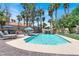 Backyard pool with waterfall feature, surrounded by lush landscaping and lounge chairs for relaxation at 1813 Skyline Dr, Las Vegas, NV 89117