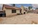 View of home's expansive backyard featuring desert landscaping and patio area at 1835 Banaba Ln, Las Vegas, NV 89156