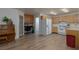 Large kitchen featuring wood cabinets, white appliances, tile floors, and a built-in desk at 1835 Banaba Ln, Las Vegas, NV 89156