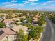 A scenic aerial captures a community, showcasing a sparkling pool and well-manicured lawns and landscaping at 2008 Aspen Oak St, Las Vegas, NV 89134