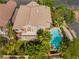 Aerial view of a two-story home, swimming pool with tropical landscaping, and small second-story balcony at 2008 Aspen Oak St, Las Vegas, NV 89134