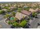 A high angle aerial view of a luxury home with pool surrounded by a lush landscape in a gated community at 2008 Aspen Oak St, Las Vegas, NV 89134
