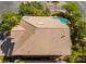Aerial view of the home featuring a tile roof, backyard pool, mature trees, and outdoor lounging area at 2008 Aspen Oak St, Las Vegas, NV 89134
