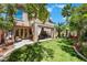 Lush backyard featuring a covered patio, dining area, and a private pool at 2008 Aspen Oak St, Las Vegas, NV 89134