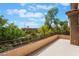 A spacious balcony shows a beautiful neighborhood view with trees and blue sky at 2008 Aspen Oak St, Las Vegas, NV 89134