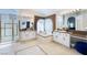 Large primary bathroom with dual vanities and a separate soaking tub at 2008 Aspen Oak St, Las Vegas, NV 89134