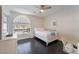 A bright bedroom features a sunny arched window and white furnishings at 2008 Aspen Oak St, Las Vegas, NV 89134