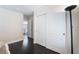 Bedroom featuring dark wood floors, white closets and baseboards at 2008 Aspen Oak St, Las Vegas, NV 89134