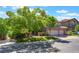 Charming two-story home featuring mature trees, green lawn and a two-car garage at 2008 Aspen Oak St, Las Vegas, NV 89134