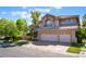 Beautiful two-story home boasting a well-manicured lawn and a spacious three-car garage at 2008 Aspen Oak St, Las Vegas, NV 89134
