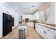 Bright kitchen featuring white cabinets and black appliances at 2008 Aspen Oak St, Las Vegas, NV 89134