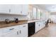 Bright kitchen featuring white cabinets, granite countertops and black appliances at 2008 Aspen Oak St, Las Vegas, NV 89134