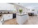 Bright kitchen with granite countertops, white cabinets, and a center island at 2008 Aspen Oak St, Las Vegas, NV 89134