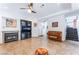 Stylish living room with fireplace, entertainment center, and staircase at 2008 Aspen Oak St, Las Vegas, NV 89134