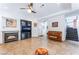 Stylish living room with fireplace, entertainment center, and staircase at 2008 Aspen Oak St, Las Vegas, NV 89134