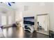 Bright living room with fireplace, dark floors, and large mirror at 2008 Aspen Oak St, Las Vegas, NV 89134