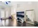 Bright living room with fireplace, dark floors, and large mirror at 2008 Aspen Oak St, Las Vegas, NV 89134