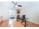 Bright office featuring light wood floors, a ceiling fan, a modern desk, and built in cabinets at 2008 Aspen Oak St, Las Vegas, NV 89134