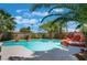 Enjoy this backyard pool and spa featuring mature tropical landscaping and rock waterfall features at 2008 Aspen Oak St, Las Vegas, NV 89134