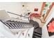 Elegant staircase with dark wood treads and white risers leading to a bright living space and pool view at 2008 Aspen Oak St, Las Vegas, NV 89134