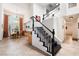 Elegant foyer with staircase leading to second floor, adjacent to dining area at 2008 Aspen Oak St, Las Vegas, NV 89134