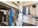 Organized walk-in closet with shelving and hanging storage at 2008 Aspen Oak St, Las Vegas, NV 89134