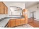Well-lit kitchen featuring decorative laminate countertops, and wood cabinets at 202 Twin Creek St, Henderson, NV 89074