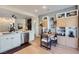 Bright dining area adjacent to the kitchen with designer storage cabinets and modern lighting at 2107 Desert Woods Dr, Henderson, NV 89012