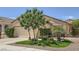 Charming single-story home with manicured front yard, desert landscaping and attached two-car garage at 2107 Desert Woods Dr, Henderson, NV 89012