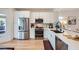Contemporary kitchen boasts sleek countertops, modern appliances, and ample storage space at 2107 Desert Woods Dr, Henderson, NV 89012