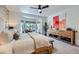 Comfortable bedroom with large dresser, decorative art and bay window with seating at 2107 Desert Woods Dr, Henderson, NV 89012
