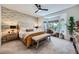 Serene main bedroom with floral wallpaper, sitting area by the windows and plush carpeting at 2107 Desert Woods Dr, Henderson, NV 89012