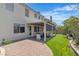 The backyard features an open patio space and a covered seating area, complemented by lush green artificial turf at 217 Turkey Creek Way, Henderson, NV 89074