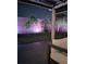 View of the backyard and a piece of patio furniture under the covered patio at 217 Turkey Creek Way, Henderson, NV 89074