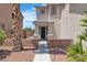 Inviting front entrance showcasing the home's facade and landscaping, including a palm tree at 217 Turkey Creek Way, Henderson, NV 89074