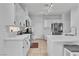 Bright kitchen showcases white cabinetry, stainless steel appliances, and a spacious island at 217 Turkey Creek Way, Henderson, NV 89074