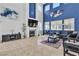 Bright living room with a fireplace, high ceilings and neutral paint, creating a cozy and inviting atmosphere at 217 Turkey Creek Way, Henderson, NV 89074