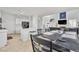Open-concept kitchen and living area with modern decor and dining space at 217 Turkey Creek Way, Henderson, NV 89074
