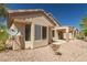 The backyard with a covered patio and desert landscaping at 2173 Point Mallard Dr, Henderson, NV 89012