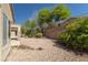 Spacious backyard with desert landscaping and mature trees at 2173 Point Mallard Dr, Henderson, NV 89012