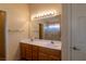 Bathroom with double sinks and a large mirror at 2173 Point Mallard Dr, Henderson, NV 89012