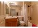Clean bathroom with a shower, tub, and traditional vanity at 2173 Point Mallard Dr, Henderson, NV 89012