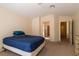 Comfortable bedroom featuring neutral walls, carpet, and an en-suite bathroom at 2173 Point Mallard Dr, Henderson, NV 89012