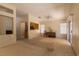 Open living room with high ceilings, fan, and natural light at 2173 Point Mallard Dr, Henderson, NV 89012