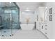 Luxurious bathroom with soaking tub, glass shower, and modern vanities at 2309 Prometheus Ct, Henderson, NV 89074